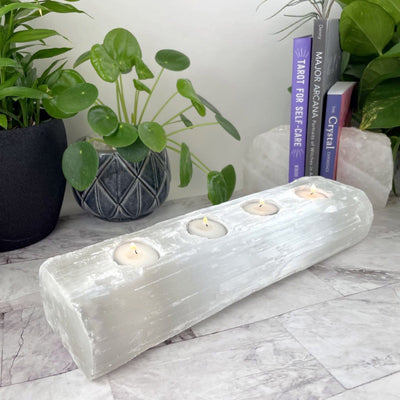 4 votive selenite candle holder with candles on display (candles not included with purchase)