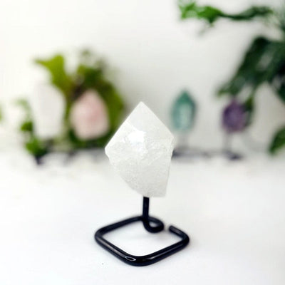 Semi Polished Points on Metal Stand with crystal quartz up close
