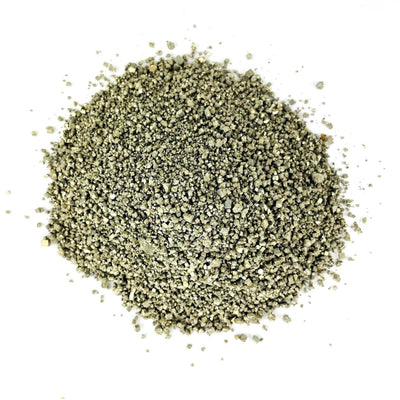Aerial view of a pile of Pyrite Dust displayed on a white surface.