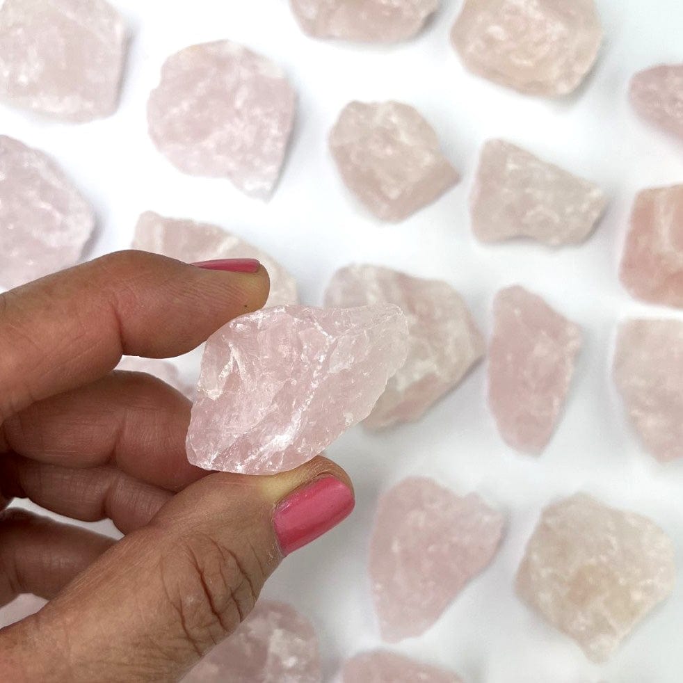 Rose Quartz Natural Stone in a hand for size reference