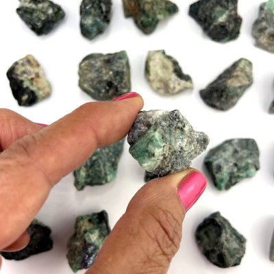 Emerald Natural Stone in a hand for size reference