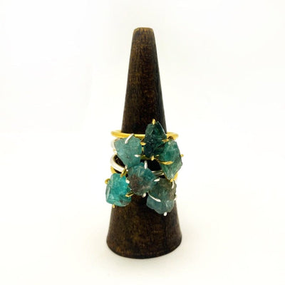Fluorite Gemstone Rings in Gold and Silver stacked on display