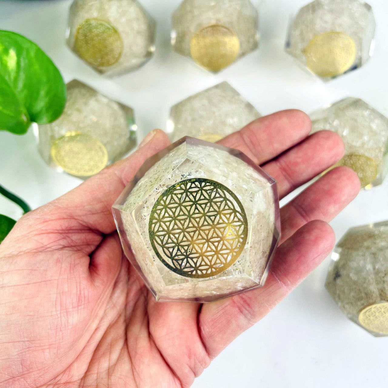 Orgone Energy - Crystal Quartz with Gold Flower of Life Grid - Dodecahedron shaped in hand