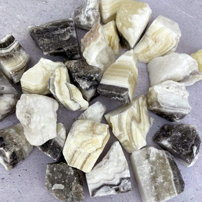 Mexican onyx stones displayed on a flat surface.