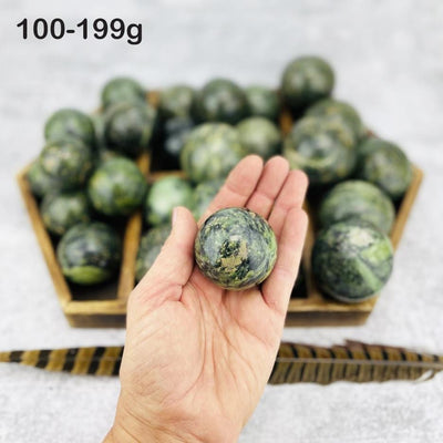  Nephrite Polished Spheres in hand for size reference weight  100-199g