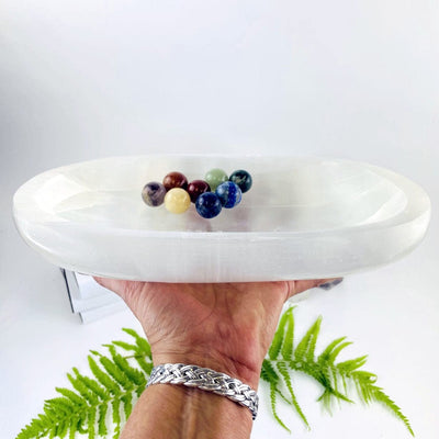 Selenite Extra Large Oval Bowl - Charging Station held in a hand