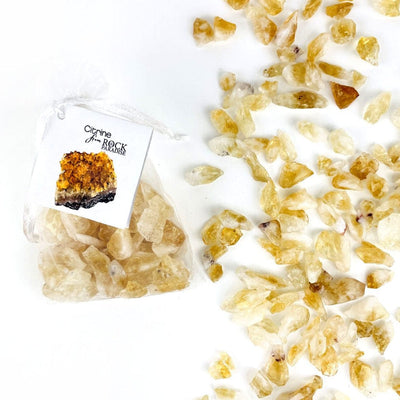 Citrine Stones - Golden Amethyst - Tied & Tagged in an Organza Bag next to some spread on a table