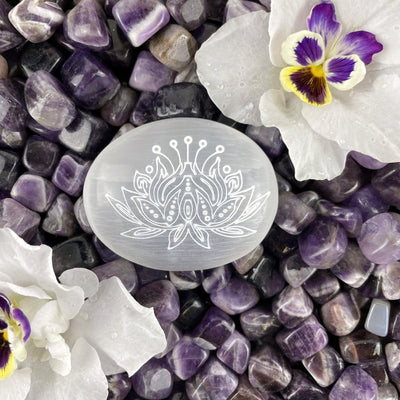 close up of one selenite lotus engraved palm stone for engraving details