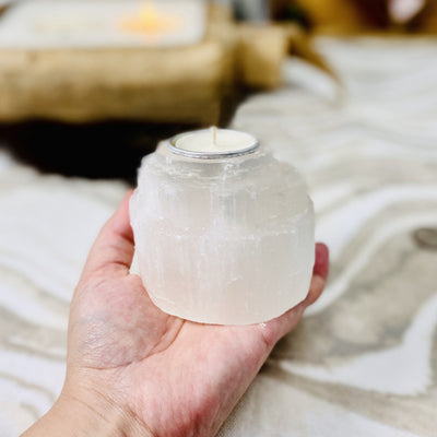selenite tower candle holder in hand for size reference