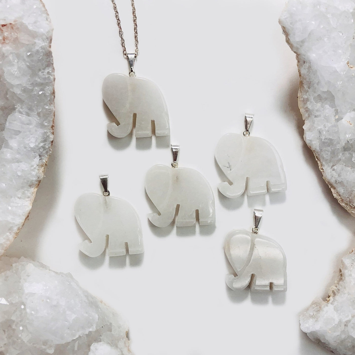 Elephant Gemstones Pendant Showing on Cristal Quarts Stone On a white background 