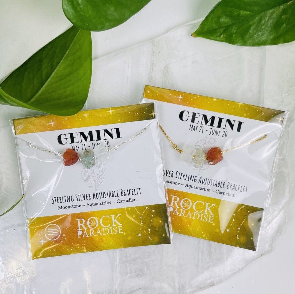 2 Gemini Bracelets in gold and silver in their packaging