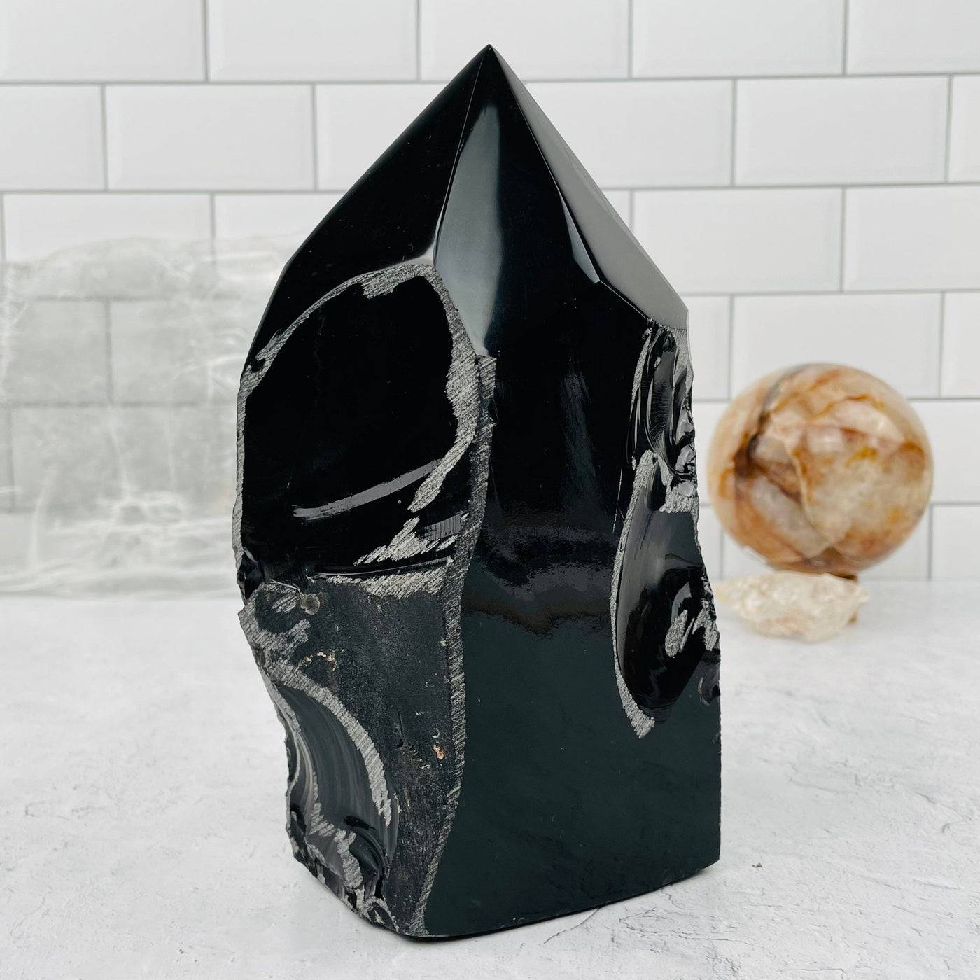 Black Obsidian Large Semi Polished Point  on display