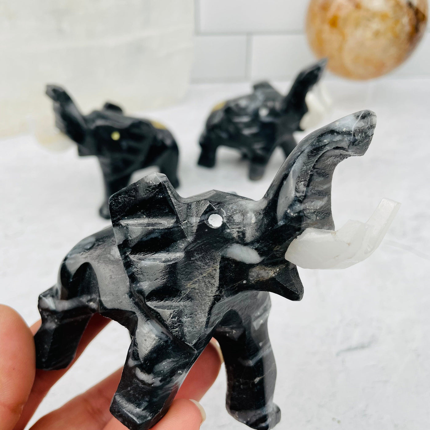 Mexican Black Onyx Elephant in hand for size reference 