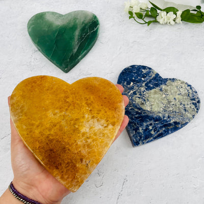 Gemstone Heart Slice in hand for size reference 