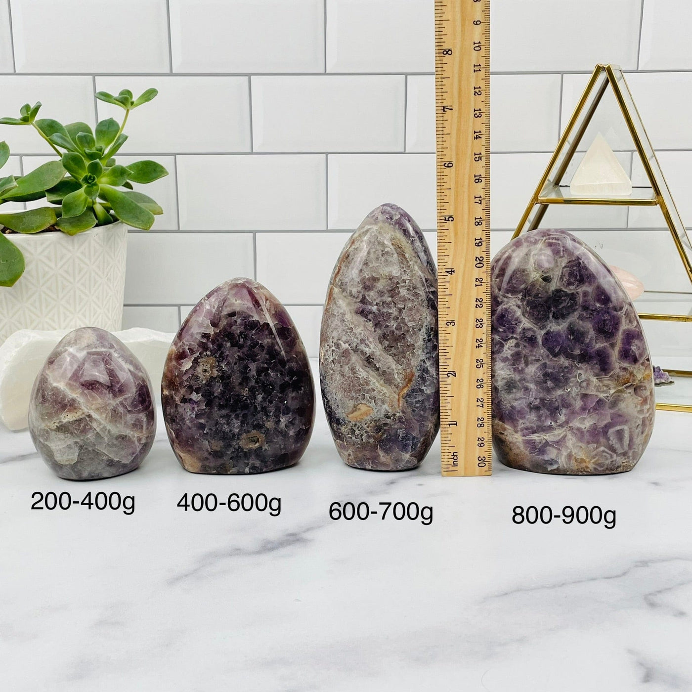chevron amethyst polished cut base next to a ruler for size reference 