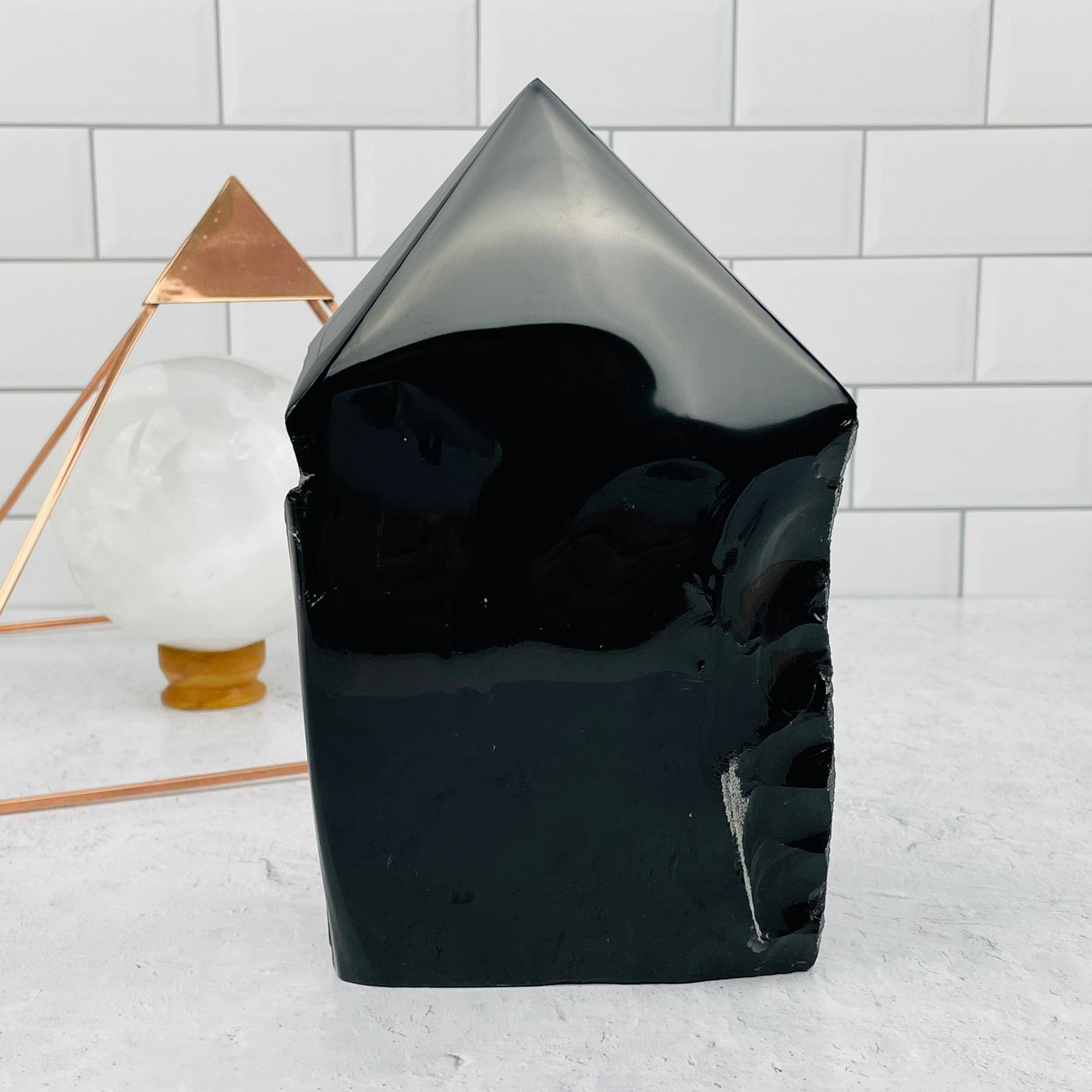 Black Obsidian Semi Polished Point displayed as home decor 