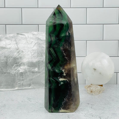 Rainbow Fluorite Polished Point Tower displayed as home decor 