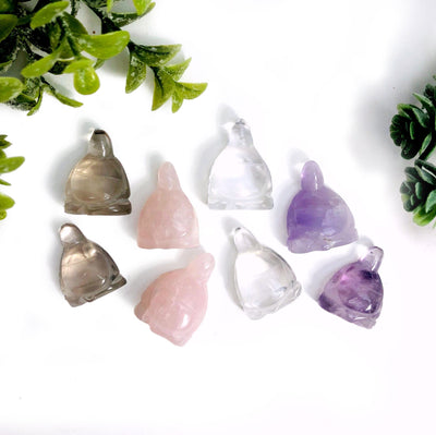 Gemstone Buddha Cabochons displayed to show they come in smoky quartz rose quartz crystal quartz and amethyst