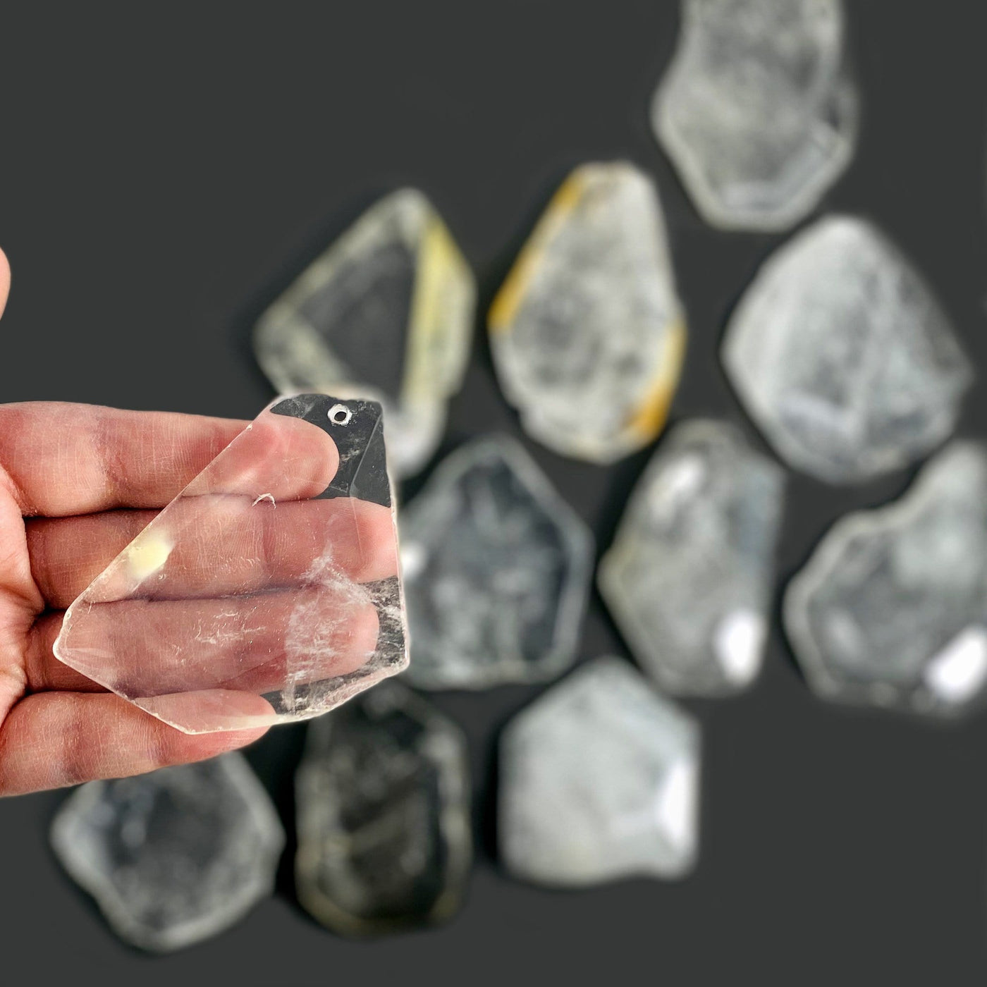 Crystal Quartz Drilled Pendant in a hand