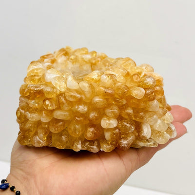 Citrine Tumbled stone Heart Candle Holder in a hand from side view