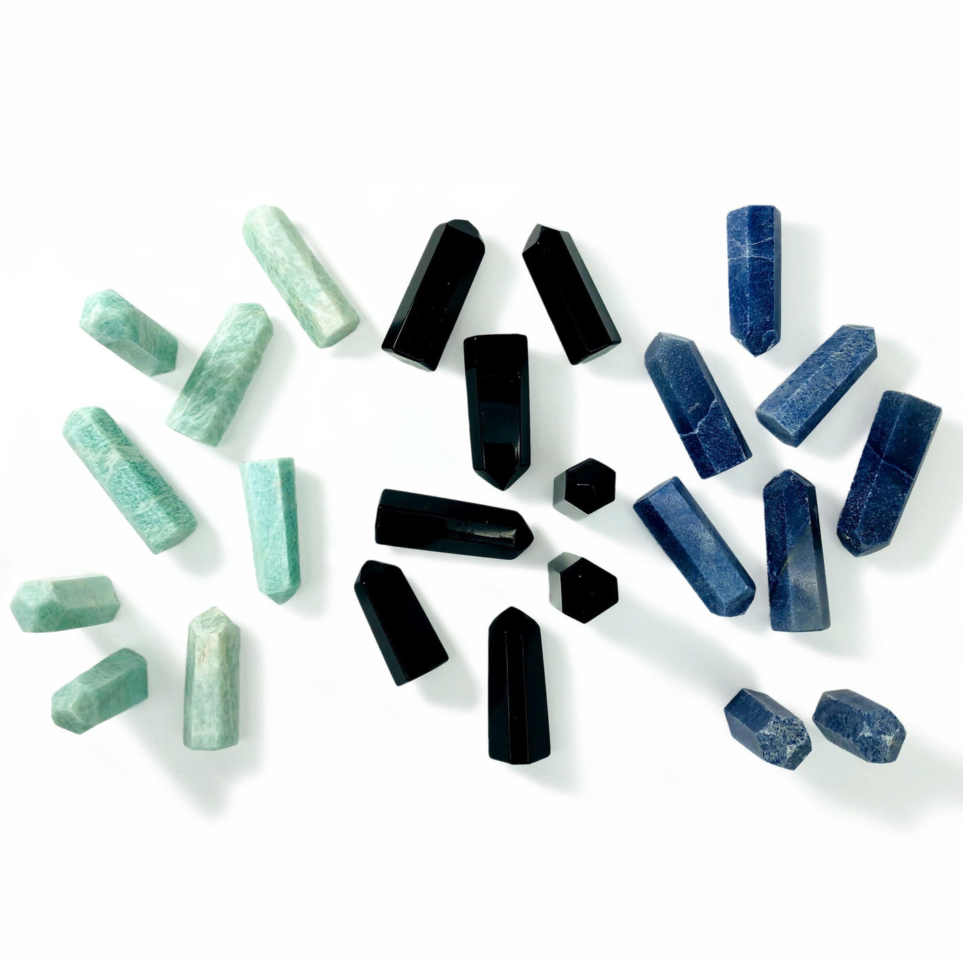 amazonite black obsidian blue quartz displayed on white background to show color variations