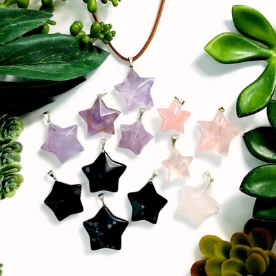Gemstone Star Pendants with Silver Toned Bail with decorations in the background