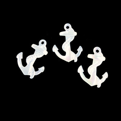 3 mother of pearl anchor displayed on black background to view characteristic differences between each bead