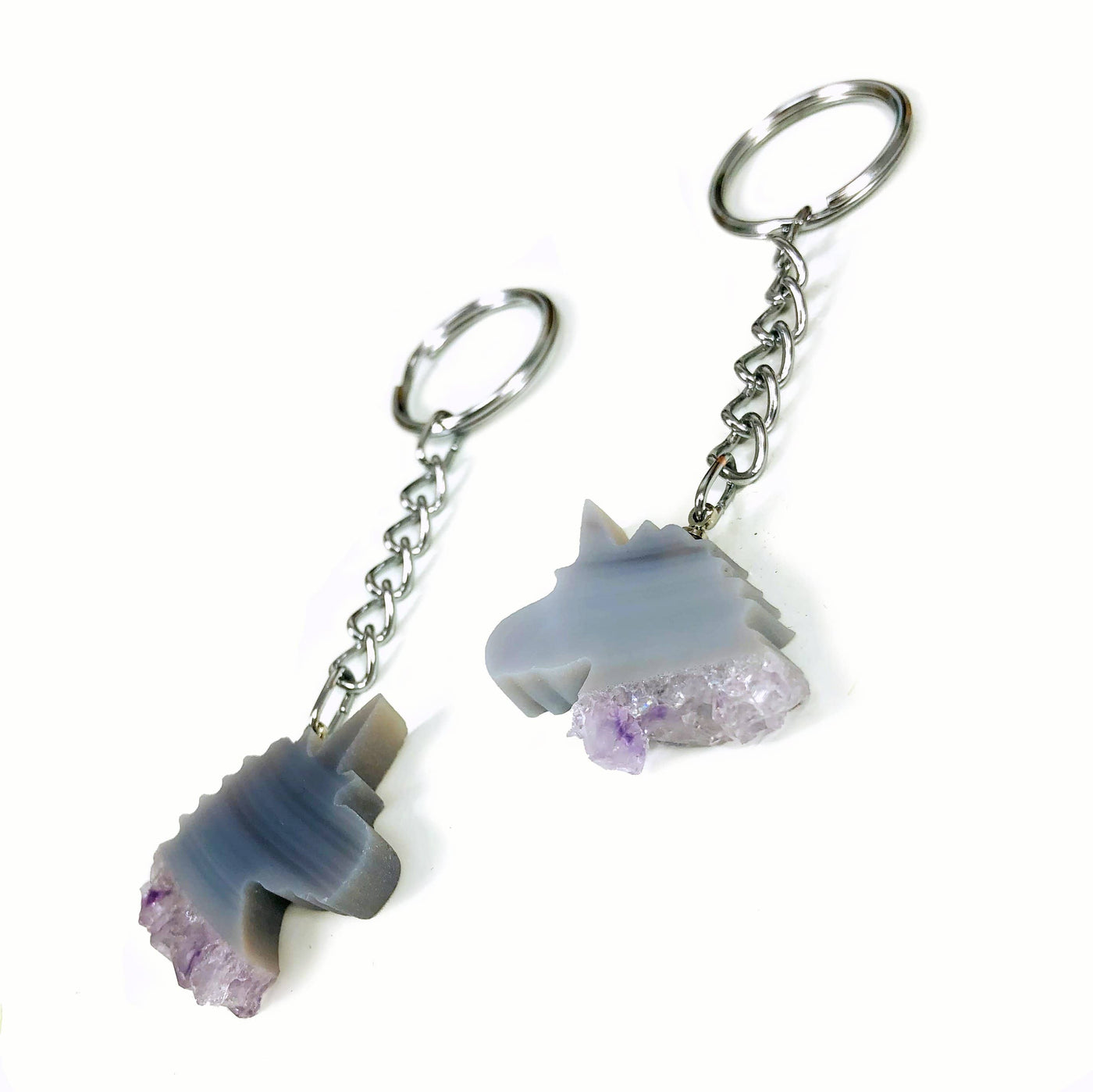Agate Unicorn keychains being displayed on a white background.