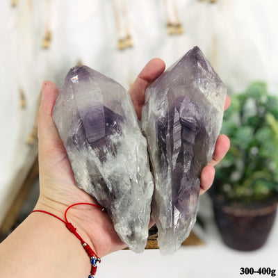 amethyst points in a hand