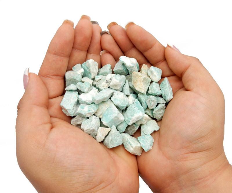 Picture of amazonite chips being held .