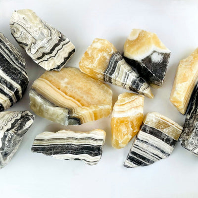 Up close view of 5 kilos worth of Mexican onyx laid out on a table as d.