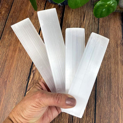 selenite bars in hand for size reference