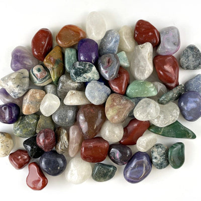 Large Tumbled Gemstones spread out on a table showing all the different stones in this collection