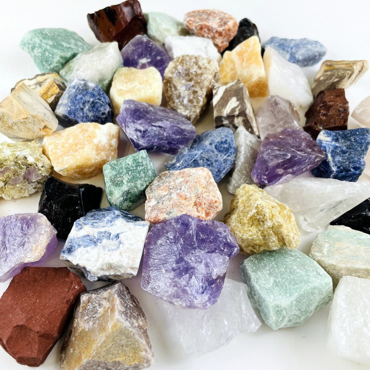 Assorted Mixed Gemstones in a pile on a table
