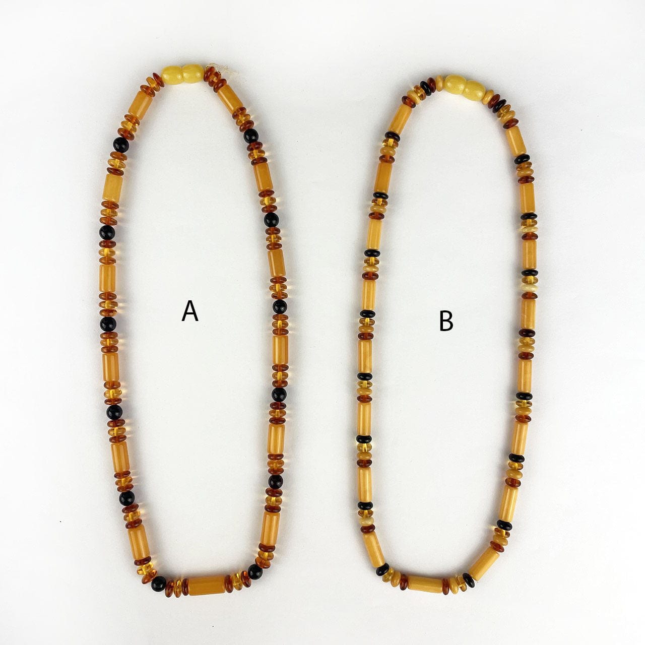 2 necklaces side by side with call out of A or B style