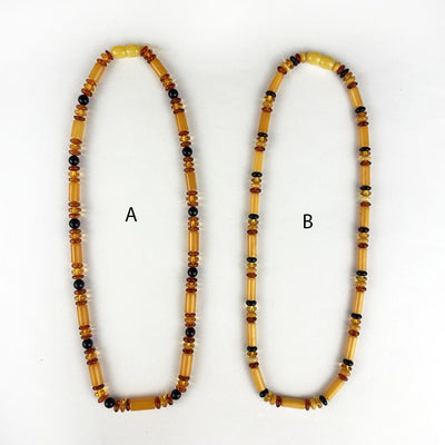 2 necklaces side by side with call out of A or B style