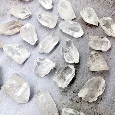 Crystal Quartz Natural Stones laid out on a table