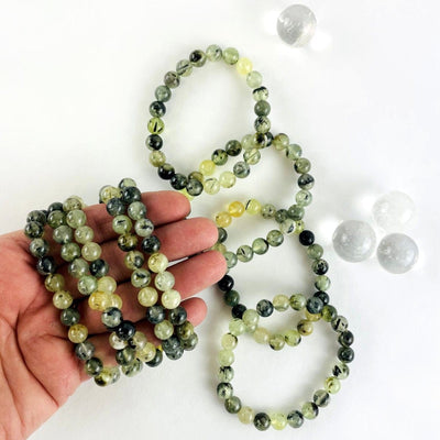 prehnite round bead bracelet in hand for size reference 