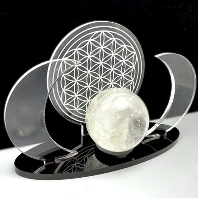Close up of an Acrylic Sphere Holder Crescent Moons with Flower of Life holding a sphere.