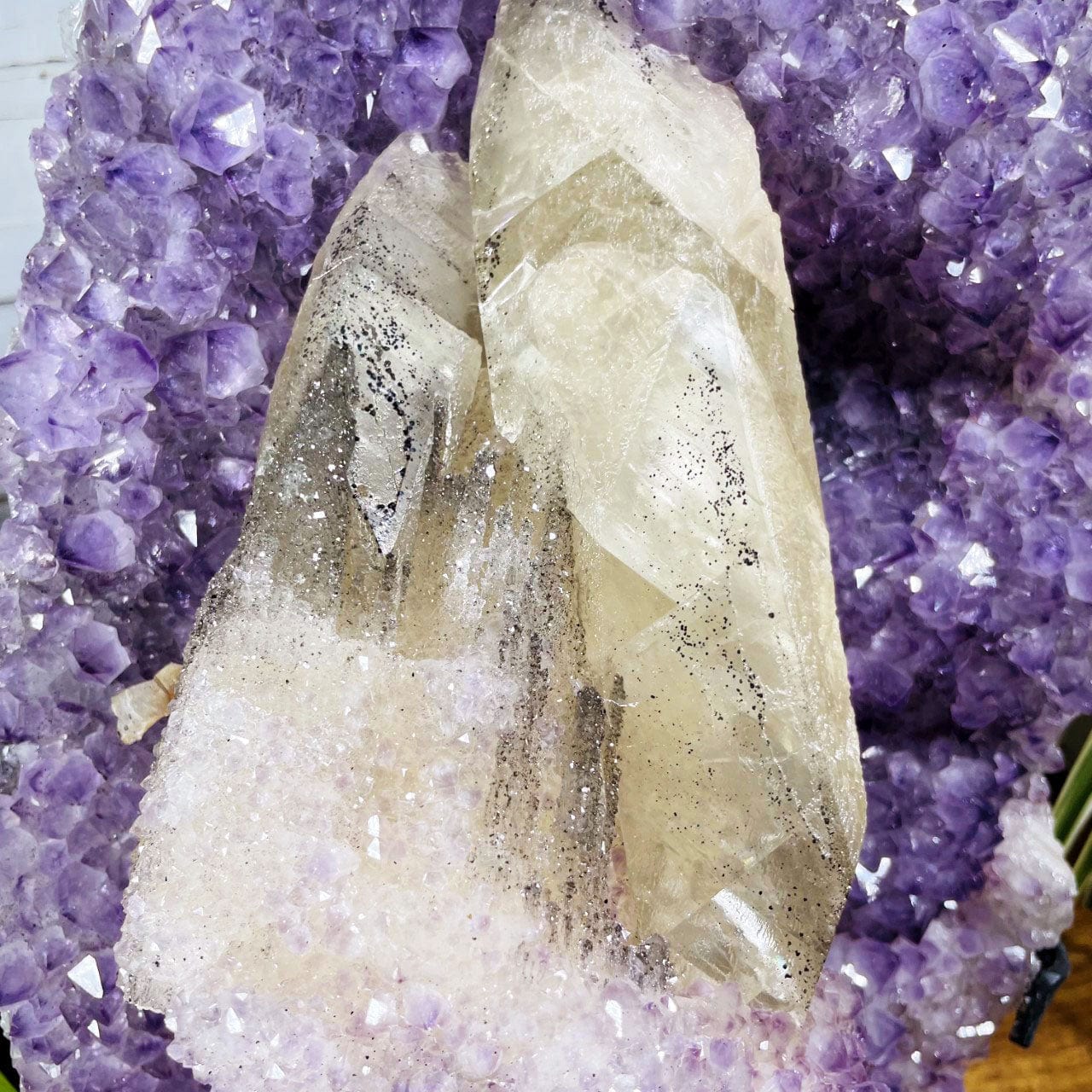 Amethyst Cluster with Calcite and Druzy on Metal Stand up close showing the silver druzy on the calcite