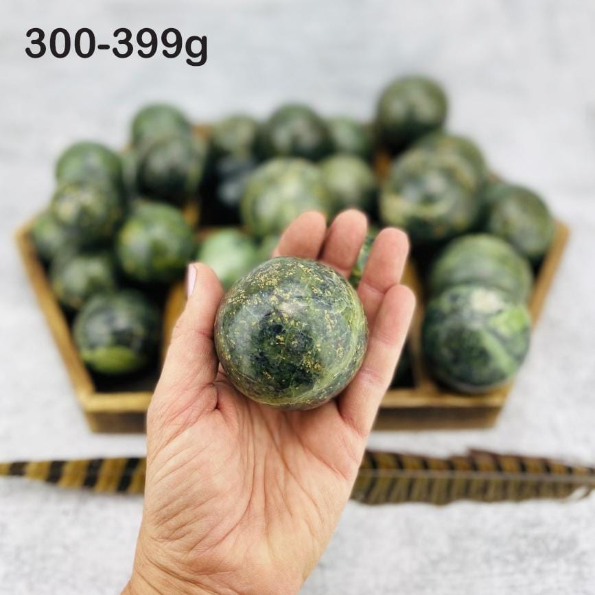  Nephrite Polished Spheres in hand for size reference weight  300-399g