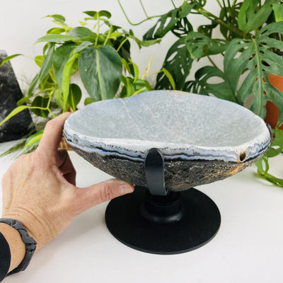 Polished Agate Dish on Metal Spinning Base with a hand for size reference