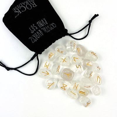 clear quartz Rune Alphabet Set of Stones spread out of a Velvet Bag