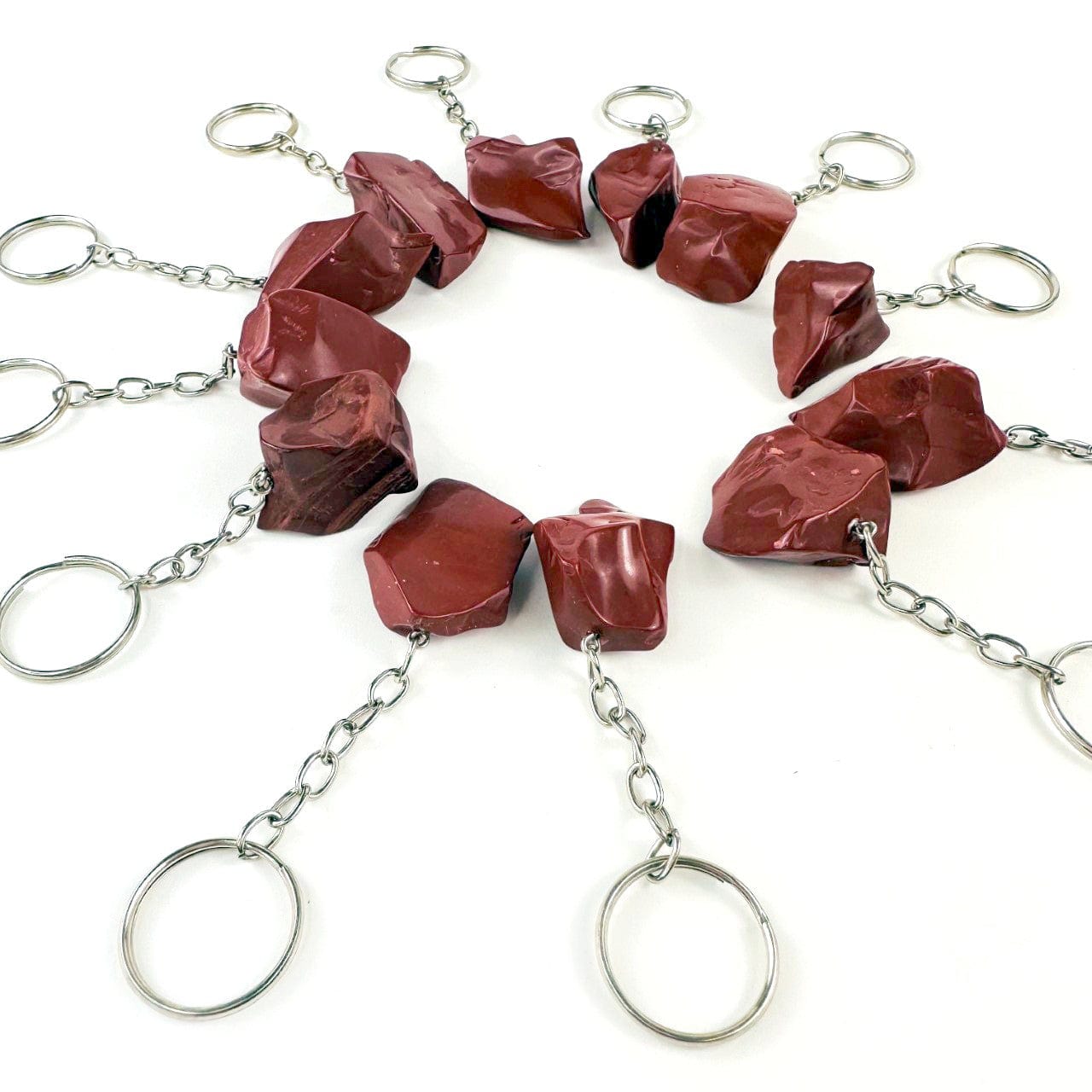 Red Jasper Polished Freeform Silver Toned Key Chains from an angle showing a side view