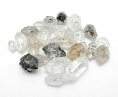 Assorted tibetan crystal quartz double terminated on a white background.