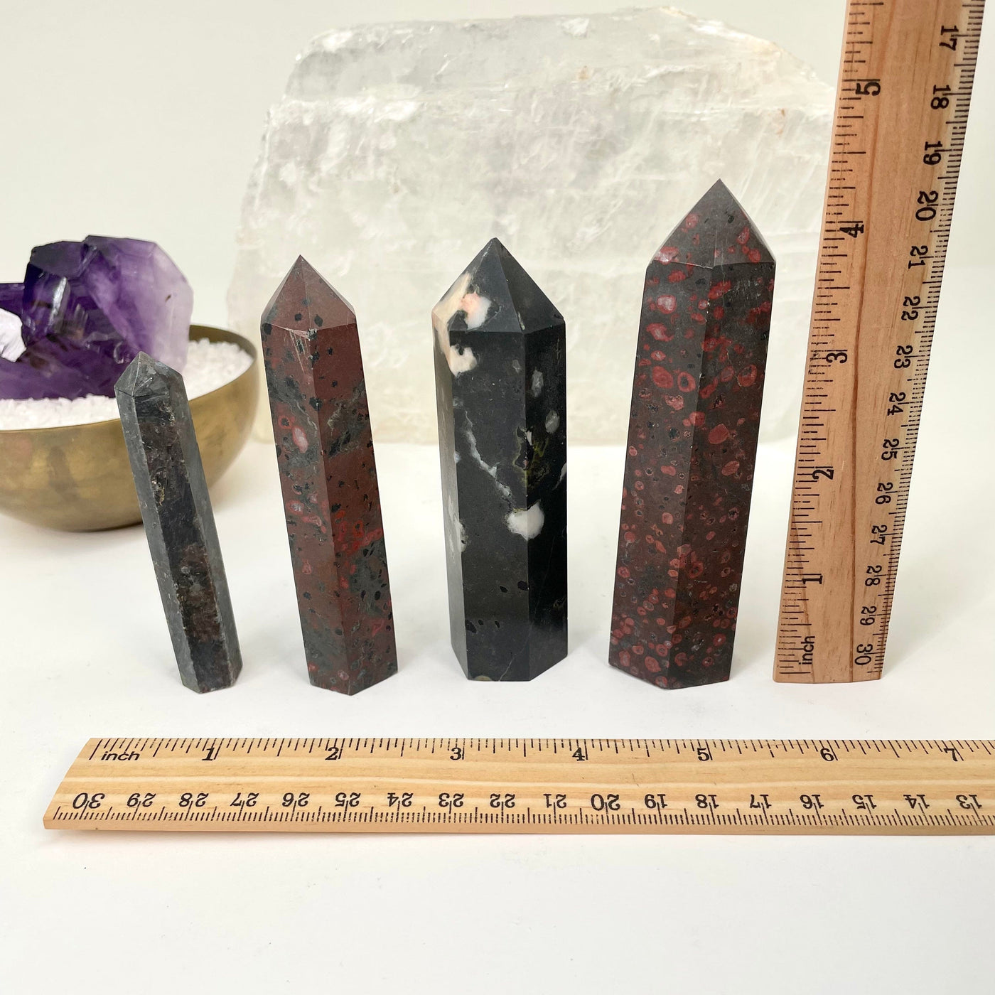 polished points next to a ruler for size reference 