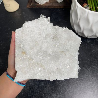 high grade crystal cluster in hand for size reference 