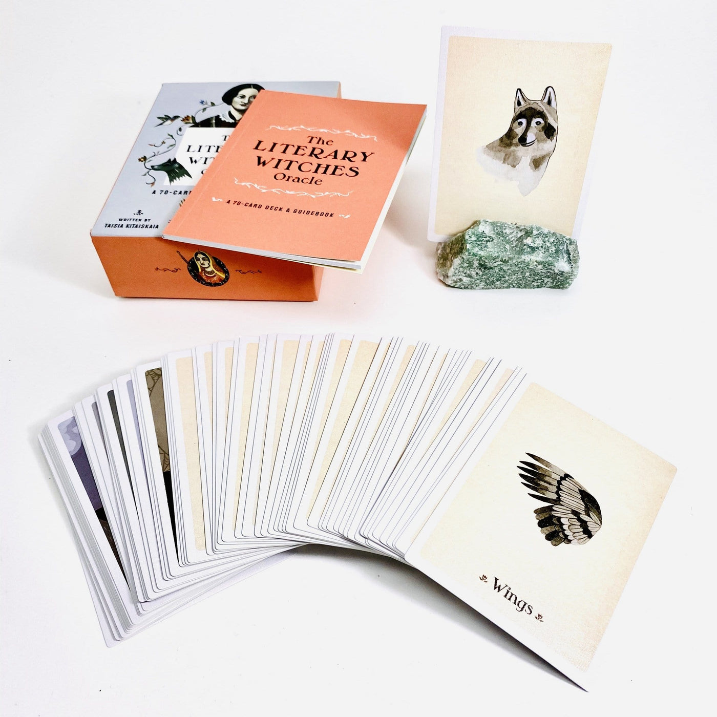 The Literary Witches Oracle cards ,Shows a small orange booklet with cards displayed to show