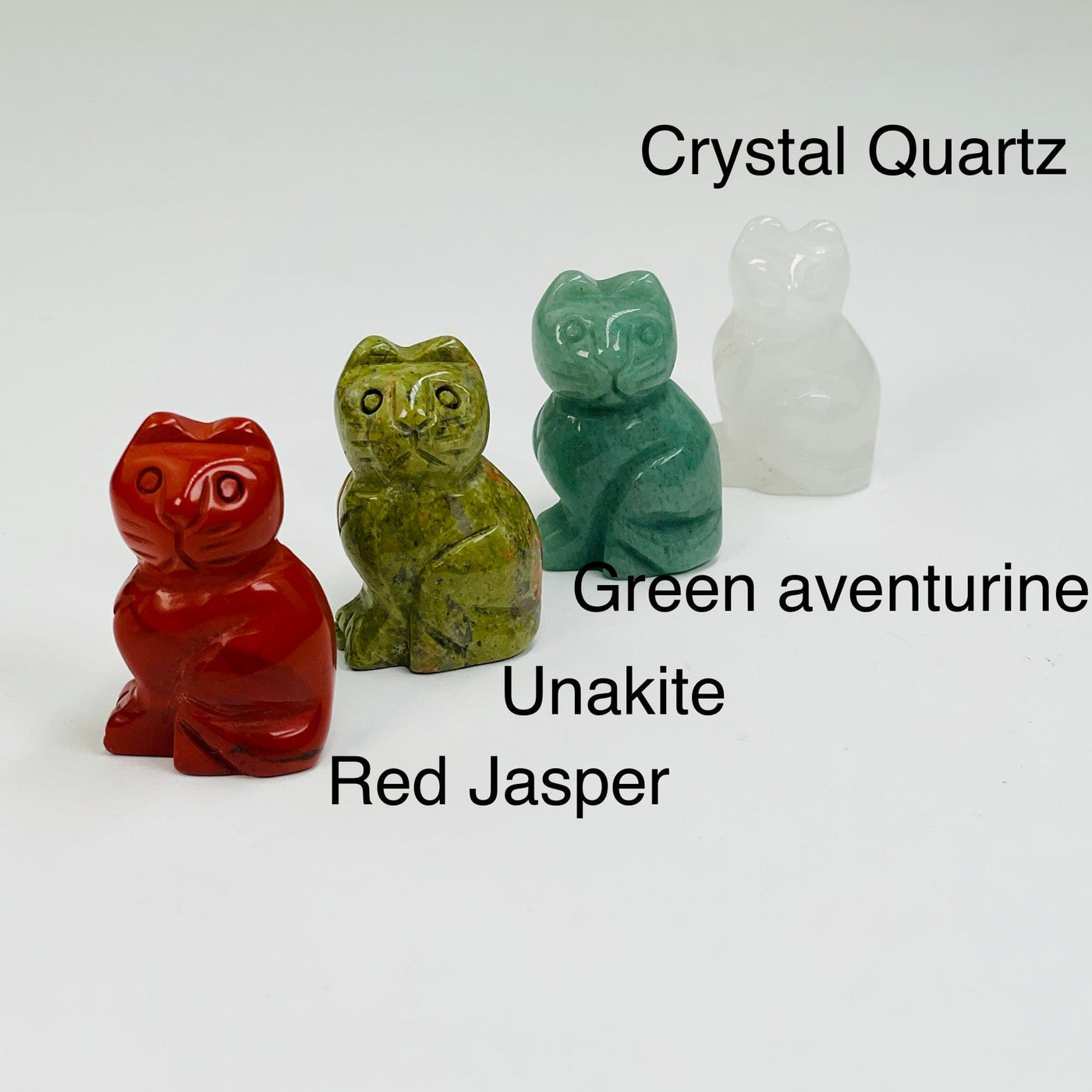 engraved gemstone cats available in crystal quartz, green aventurine, unakite and red jasper 