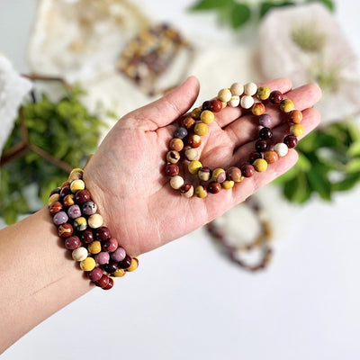 Mookaite Round Bead Bracelets 6mm on wrist and in hand for size reference 